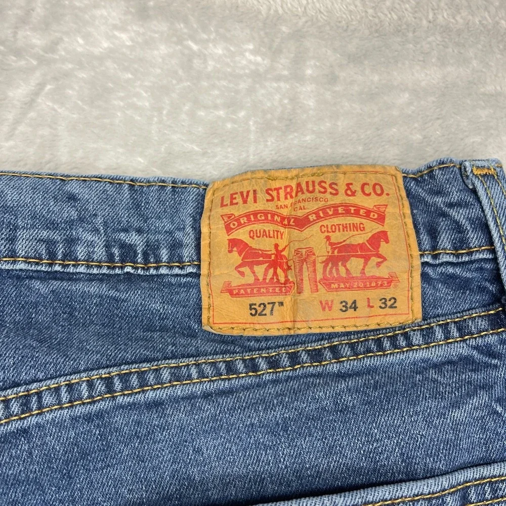 Levi's Jeans Mens 34x32 Blue Denim 527 Stretch Faded Mid Rise Slim Bootcut Leg